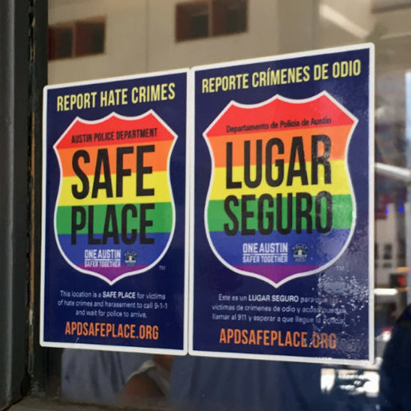Photo of police-sponsored Safe Place posters in window